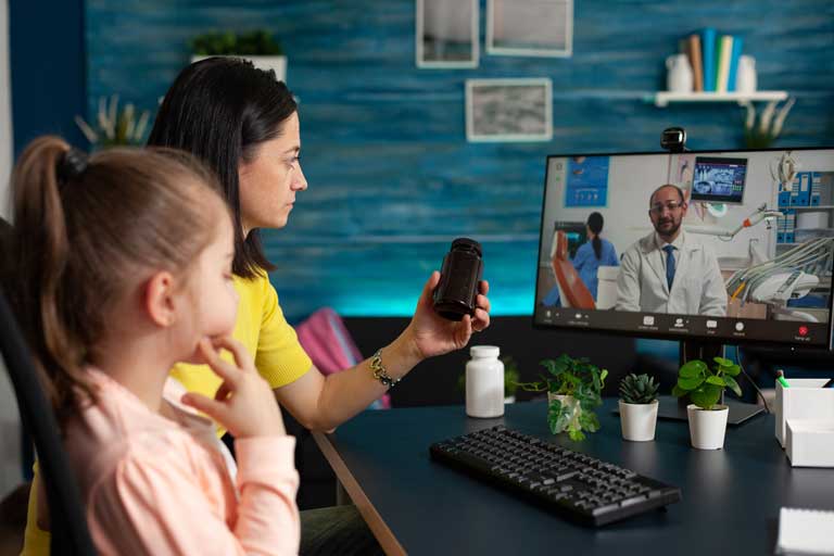 Parent discussing medicine options with a doctor via virtual healthcare
