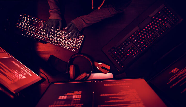 Hacker typing on a keyboard
